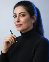 Portrait of Yasmin, the fictional persona of the Conductor, an AI agent