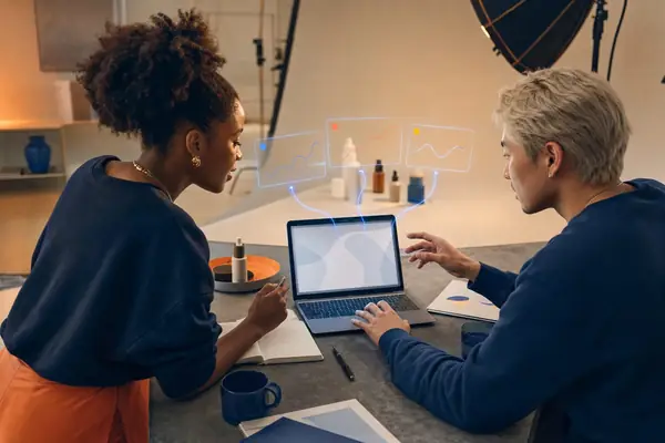 Illustrative photo: the Meta Ads Agent at work for a founder and creator planning next week's Facebook and Instagram ads, with results laid out as blue panels above a laptop.
