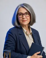 Portrait of Mirela, the fictional persona of the Ai1 Operations, an AI agent