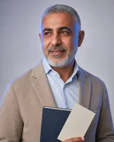 Portrait of Tariq, the fictional persona of the Prediction Agent, an AI agent