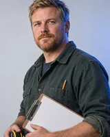 Portrait of Rhys, the fictional persona of the Quote Builder, an AI agent