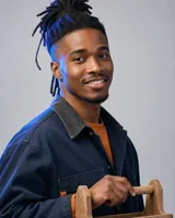 Portrait of Malik, the fictional persona of the Skill Manager, an AI agent