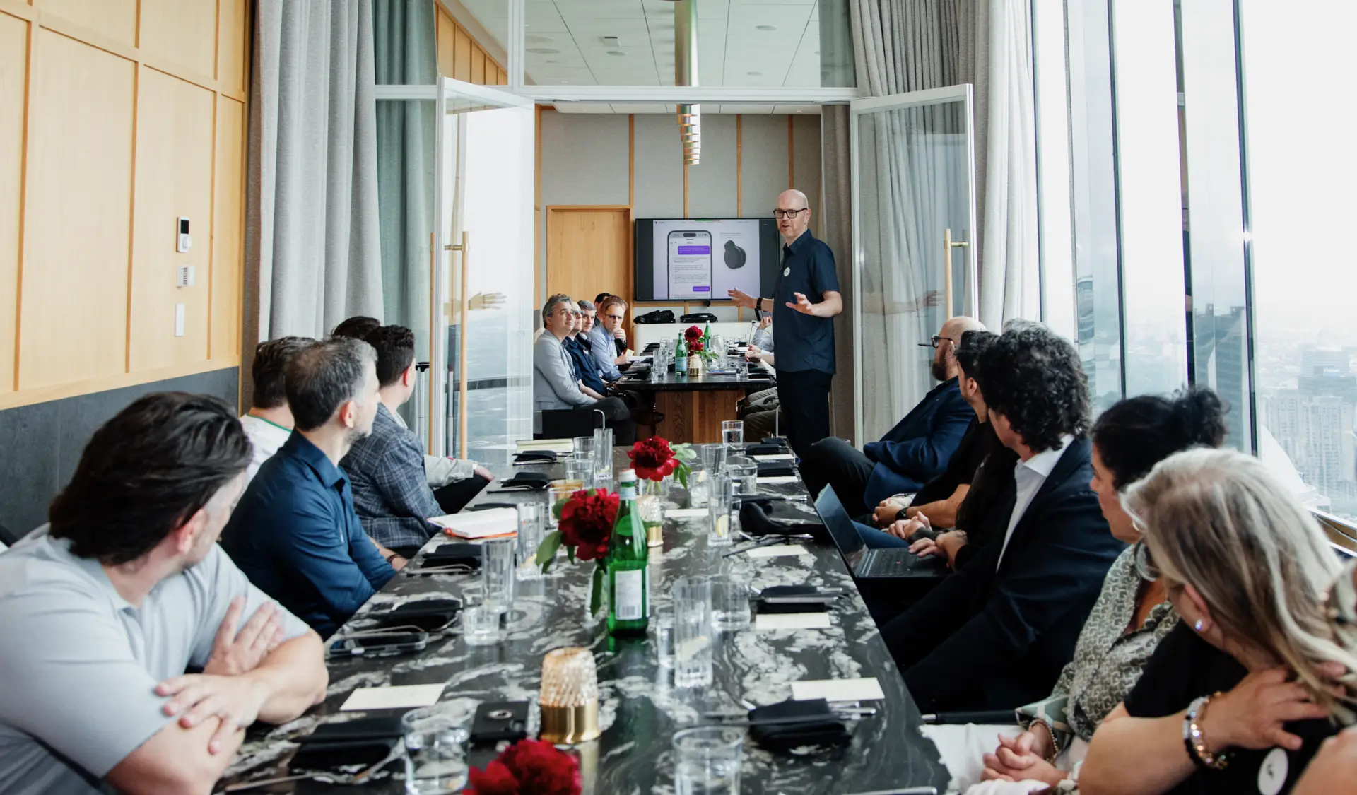 Mike Schwarz presenting to founders around a long table at the EO One Canada Conference, Montreal