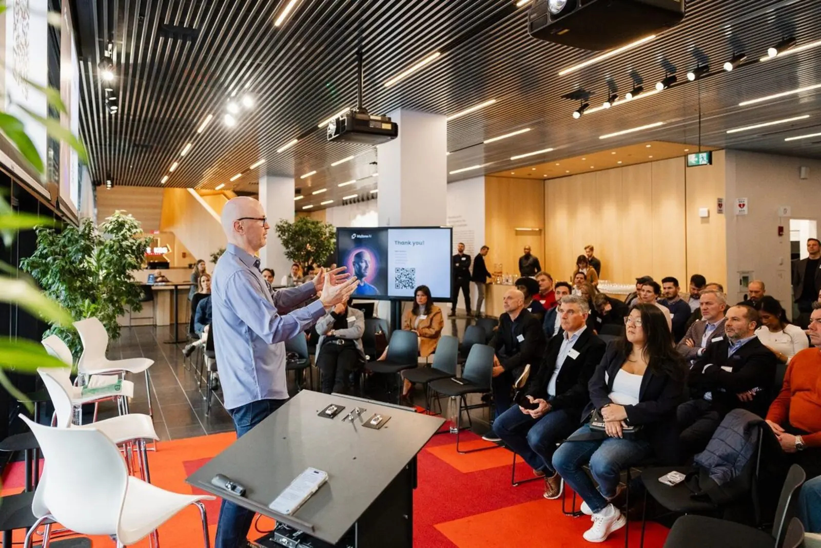 Mike on stage at the EO Montreal AI Wake Up Call